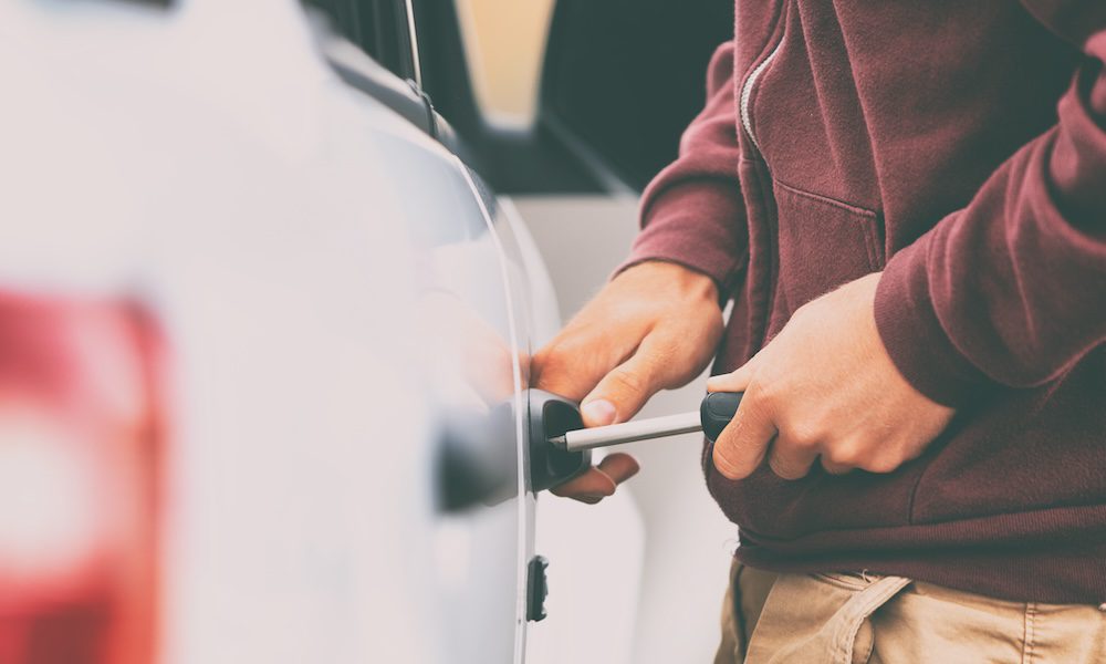 thief breaking into car